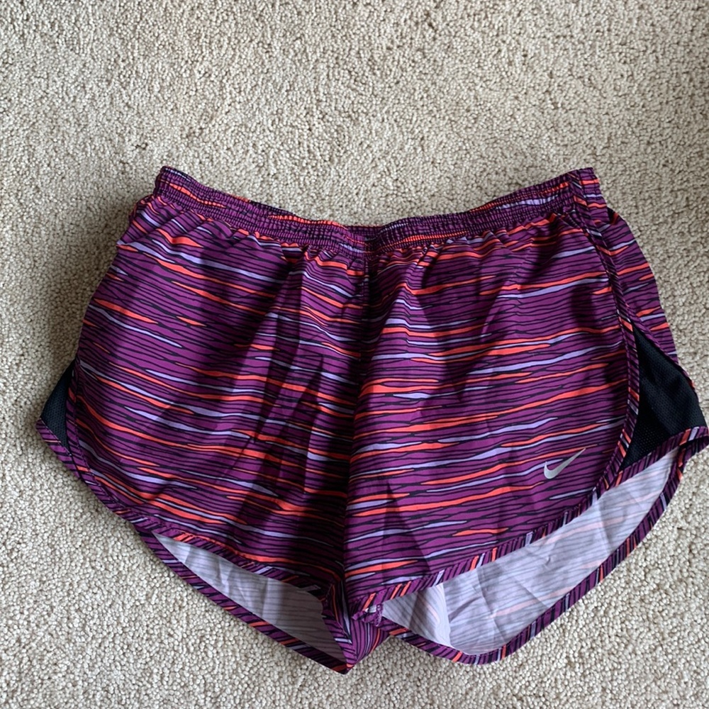 Nike dry fit running shorts purple, pink, and orange/red pattern with pocket